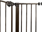 Regalo extra tall metal safety barrier installed at bottom of stairs