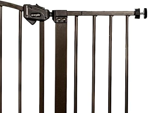 Regalo extra tall metal safety barrier installed at bottom of stairs