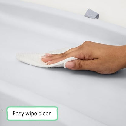 Ingenuity changing pad placed on a nursery dresser