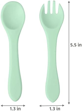 A baby holding the easy grip handle of the PandaEar silicone fork
