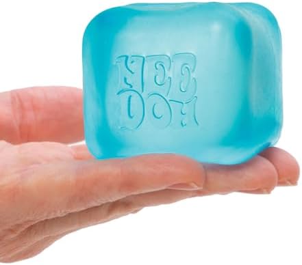 Pocket sized portable design of Schylling cubical stress toys resting in a palm.