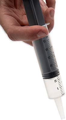 Lixit 35 milliliter syringe showing tapered catheter tip and rubber plunger seal