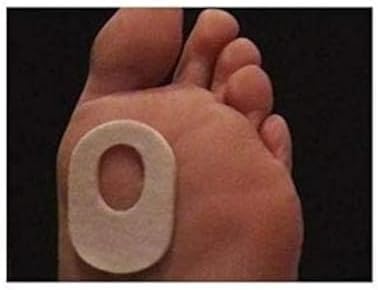 Close up of 1/8 inch thick oval white felt foot pads for callus protection
