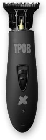 TPOB Ghost X Blackout trimmer being cleaned with the included brush.