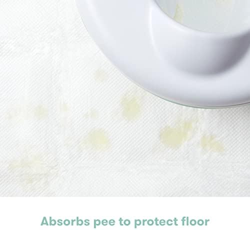 Frida Baby absorbent floor pad demonstrating liquid containment to prevent floor messes