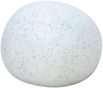 A hand squeezing the white crunchy snowball stress ball to demonstrate its moldable texture.