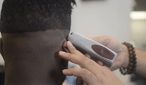Complete Andis beard and hair trimming kit with power cord accessories.