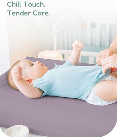 TotChill flexible infant dresser top sheet stretched over a standard contoured diaper changing pad.