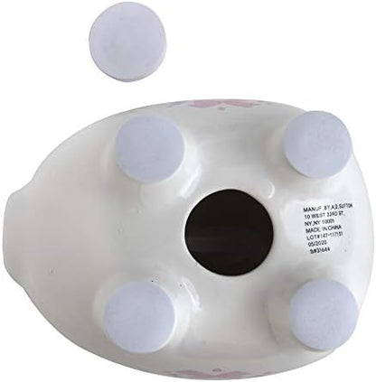 Baby Essentials My First Piggy Bank styled beautifully on a modern baby girl nursery room shelf.