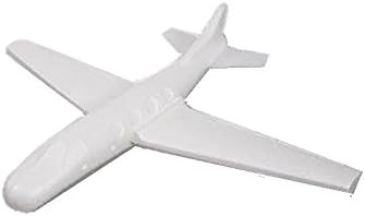 Planeur customizable toy airplane being hand launched outdoors in an open field.