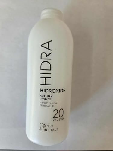 Creamy consistency of Hidra Hidroxide 6 percent developer being dispensed for hair coloring