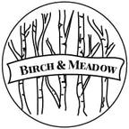 Birch And Meadow Carrot Powder packaging with black ribbed lid