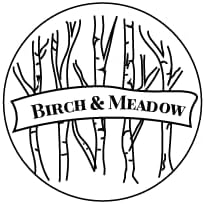Birch And Meadow Carrot Powder packaging with black ribbed lid