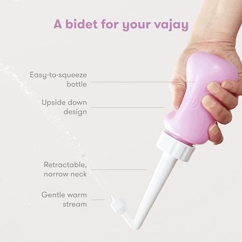 Frida Mom portable bidet held upside down demonstrating ergonomic use