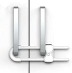 White child safety lock installed on kitchen cabinet handles