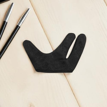 Side profile view of the black heat blocking gloves showcasing flexible fabric stitch detail.