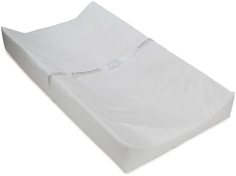 Delta Children Contoured Changing Pad angled view with safety strap