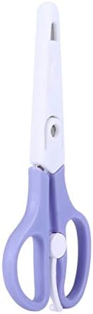 Compact thirty-six gram infant food shears alongside its plastic sheath