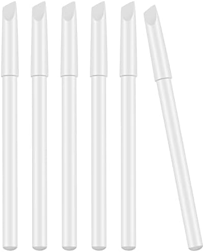 Close up view of the 2-in-1 white nail pencil tip and the integrated cuticle pusher cap.