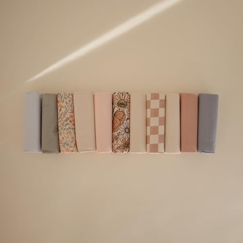 Three pack Mushie changing pad liners folded for storage