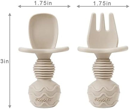 Toddler using ergonomic silicone fork and spoon set
