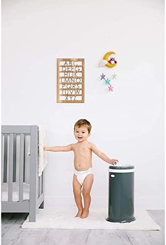 Ubbi diaper pail showing interior with standard trash bag compatibility