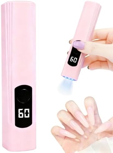 Compact cordless single finger UV nail lamp being held to demonstrate portable pocket size