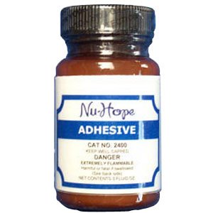 Nu-Hope Labs Adhesive with Applicator 2 Ounce bottle front view for secure ostomy bonding.