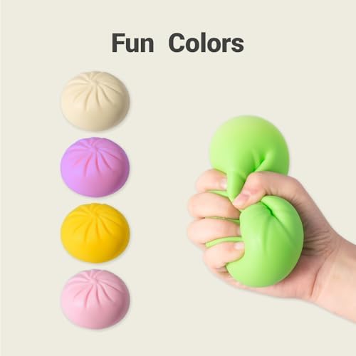 Pink smiling dumpling squishy toy being squeezed by hand to show the slow rising soft texture
