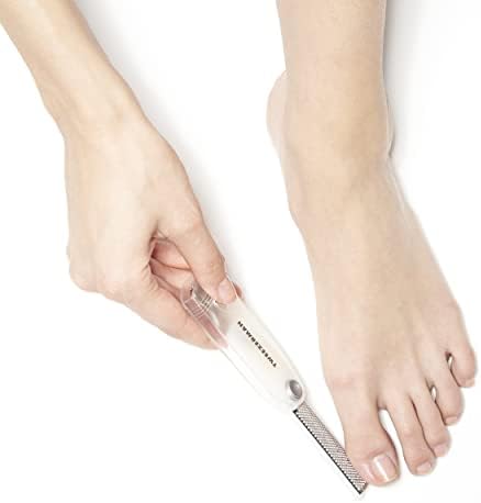Tweezerman 2-in-1 foot care tool in white and silver for at-home callus treatment.