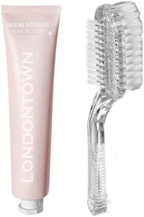Brightening nail whitener treatment paste being applied to stained fingernails with a clear handle grip brush