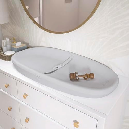 Evolur Eva changing pad placed on a nursery furniture unit