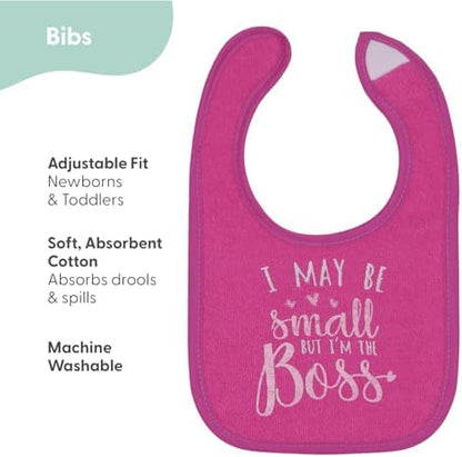 Close up view of the adjustable hook and loop closure on the pink infant bib