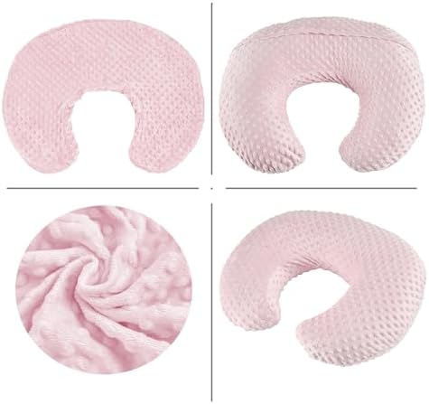 Baby using nursing pillow for bottle feeding support