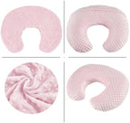 Baby using nursing pillow for bottle feeding support