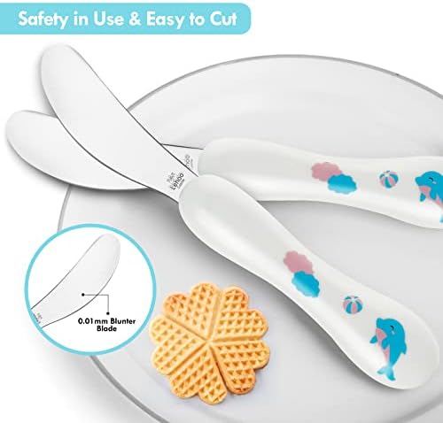 Toddler using Lehoo Castle fork and spoon for self feeding