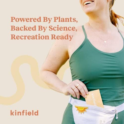 Kinfield Golden Hour natural insect repellent wipes being applied to arms for outdoor protection