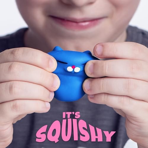 Two inch soft silicone miniature cat fidget toys being squeezed for anxiety relief.