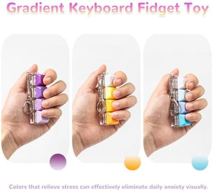 A person holding the colorful mechanical keyboard keychain while clicking the matte keycaps with four fingers.