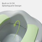 Toddler using KÜB 3-in-1 potty seat on standard toilet