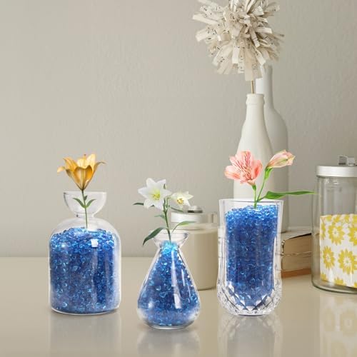 Textured blue sea glass pebbles in a glass bowl