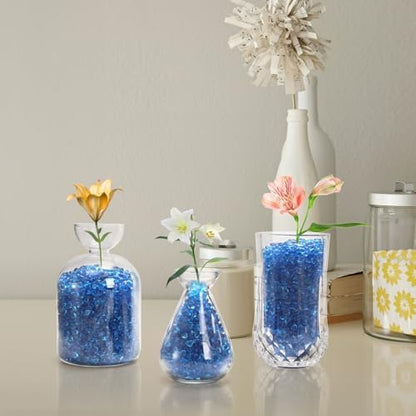Textured blue sea glass pebbles in a glass bowl