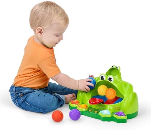Bright Starts baby activity toy demonstrating the side ramps with balls rolling down for motor skill development.