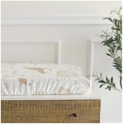 Crane Baby Kendi safari animal printed changing pad cover displaying the secure elastic edges designed for slip resistant placement.