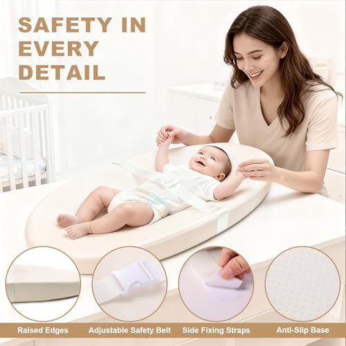 Qalvyn lightweight changing station placed on top of a modern nursery dresser