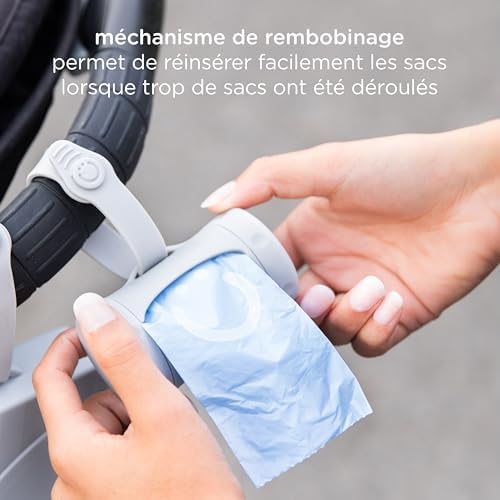 Ubbi bag dispenser attached to a diaper bag