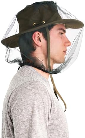 Coghlan's green mosquito head net in outdoor setting.