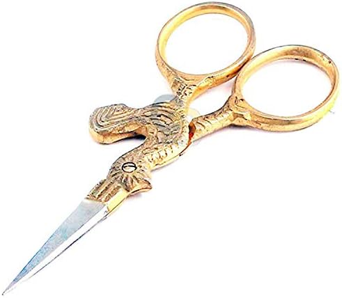 Close up view of the sharp stainless steel blades on the vintage style gold chicken scissors