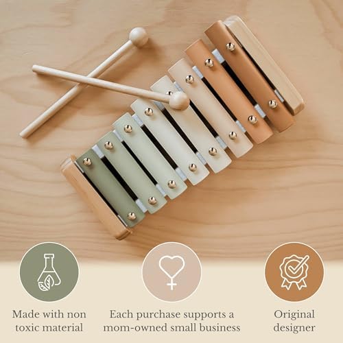 Brooklyn Neutral boho style baby musical toy with two wooden mallets resting beside the instrument scale