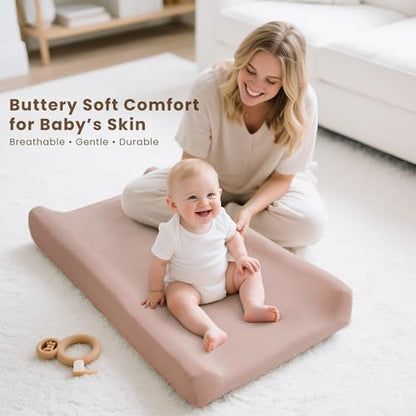 Konssy pink spring diaper changing sheets stretched securely over a standard nursery pad
